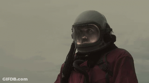 Man In Helmet And Gloves Waving GIF