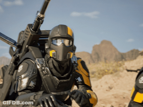 Man In Helmet And Goggles Holding Gun GIF