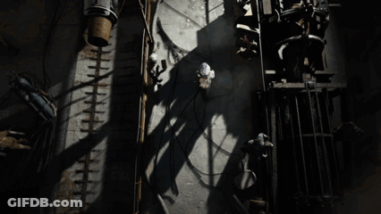 Man In Helmet And Goggles Looking Up At Light GIF