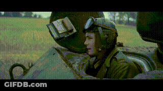 Man In Helmet And Goggles Sitting In Tank GIF