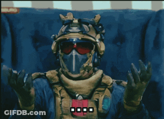 Man In Helmet And Goggles Sitting With Hands Up GIF