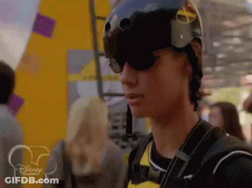 Man In Helmet And Sunglasses In Front Of Disney Logo GIF