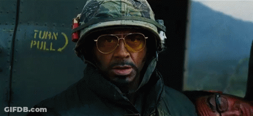 Man In Helmet And Sunglasses In Front Of Turn Pull Sign GIF