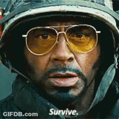 Man In Helmet And Sunglasses Says Survive GIF