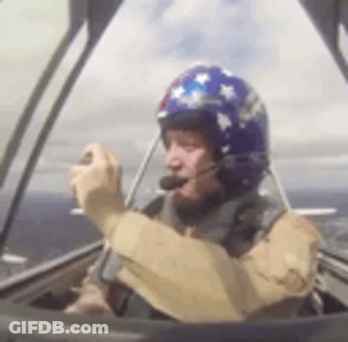 Man In Helmet Driving Plane GIF