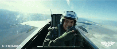Man In Helmet Flying In Top Gun GIF