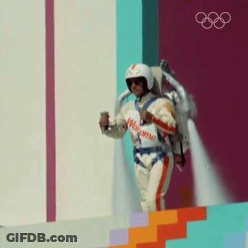 Man In Helmet Flying With Welcome Sign GIF