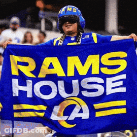 Man In Helmet Holding Blue Rams Flag GIF