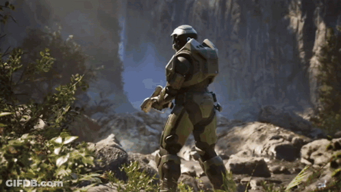 Man In Helmet Holding Glowing Blue Sword GIF