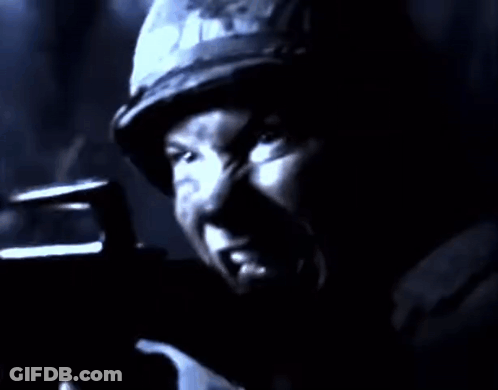 Man In Helmet Holding Gun GIF