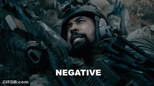 Man In Helmet Holding Gun Saying Negative GIF