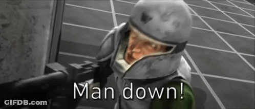 Man In Helmet Holding Gun Says Man Down GIF
