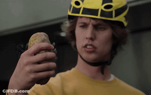 Man In Helmet Holding Potato GIF