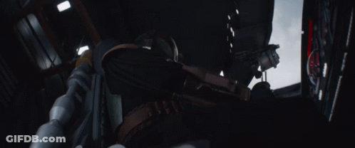 Man In Helmet Holding Red Item Saying A GIF