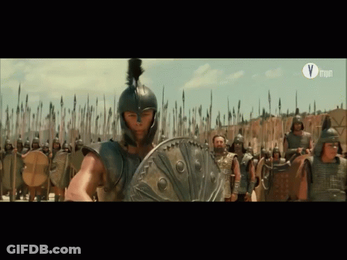 Man In Helmet Holding Shield Before Soldiers Letter V GIF