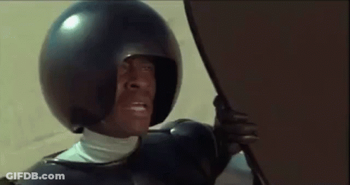 Man In Helmet Holding Shield GIF