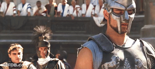 Man In Helmet In Front Of Crowd GIF