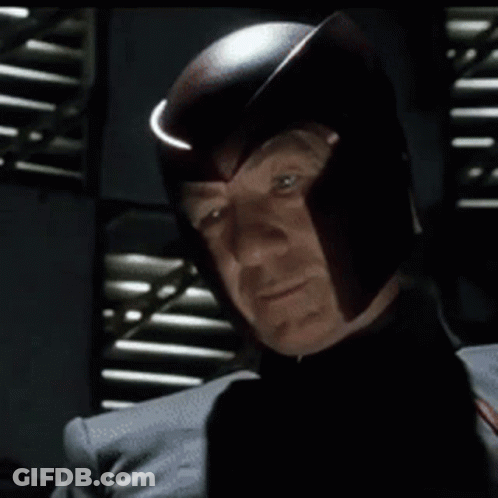 Man In Helmet Looking At Camera GIF