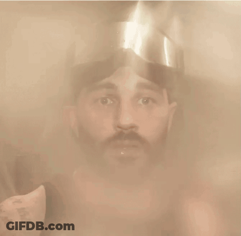 Man In Helmet Looking At Camera GIF
