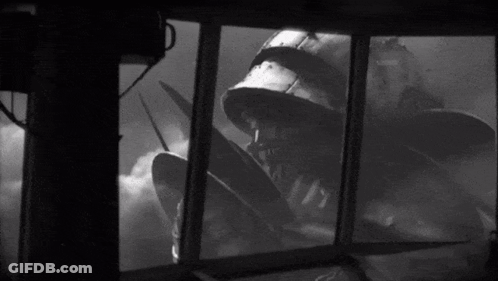 Man In Helmet Looking At Monster GIF