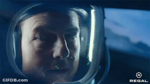 Man In Helmet Looking Out Window With Regal Logo GIF