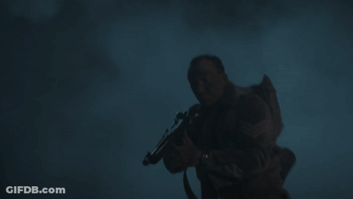 Man In Helmet Next To Man In Sweater GIF