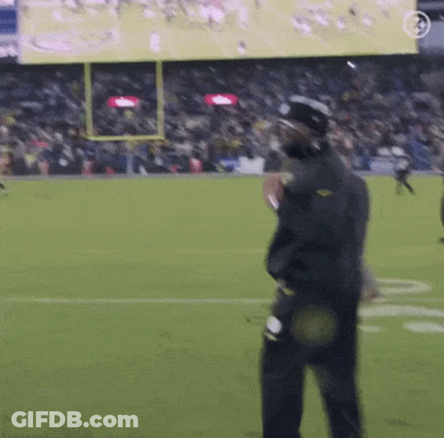 Man In Helmet On Football Field GIF
