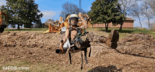 Man In Helmet On Swing GIF