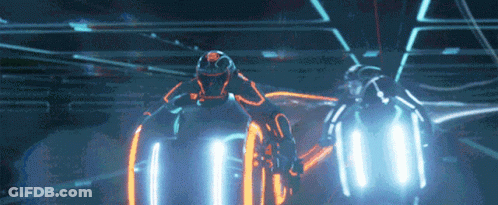 Man In Helmet Riding Futuristic Motorcycle In Dark Room GIF