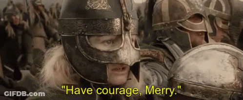 Man In Helmet Says Have Courage Merry To Crowd GIF