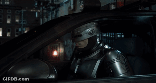 Man In Helmet Sitting In Car Looking Out Window GIF