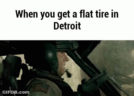 Man In Helmet Sitting In Car With Gun GIF
