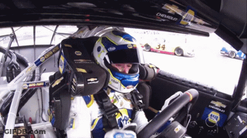 Man In Helmet Sitting In Race Car 34 GIF