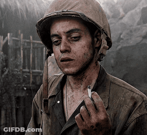 Man In Helmet Smoking Cigarette GIF