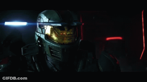 Man In Helmet Standing In Dark GIF
