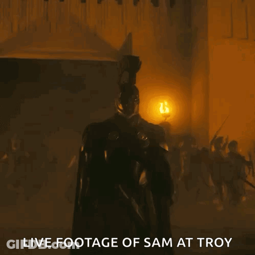 Man In Helmet Standing In Dark Room Saying Live Footage Of Sam At Troy GIF