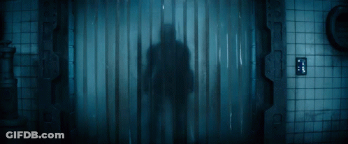 Man In Helmet Standing In Dark Room GIF