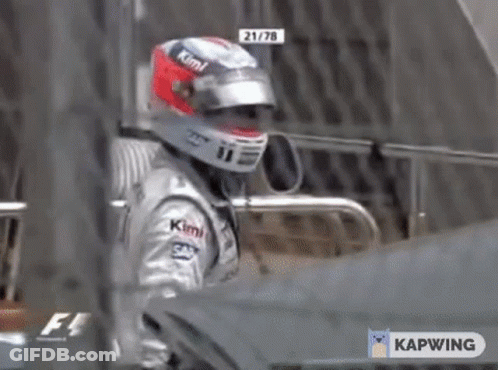 Man In Helmet Standing In Front Of Car GIF