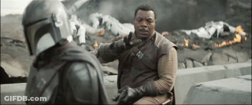 Man In Helmet Talking To Suit GIF