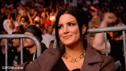 Man In Helmet Talking To Woman In Black GIF