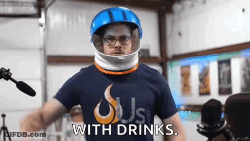 Man In Helmet With Drinks Shirt GIF