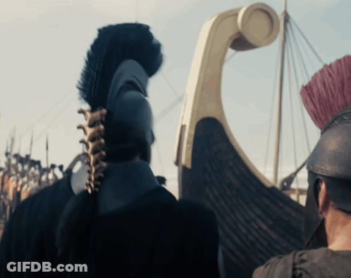 Man In Helmet With Feathered Crest In Front Of Boat GIF