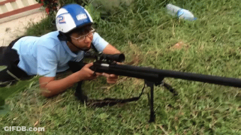 Man In Helmet With Number 2 Holding Rifle GIF