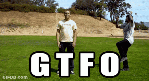 Man In Helvetica Shirt In Field GIF