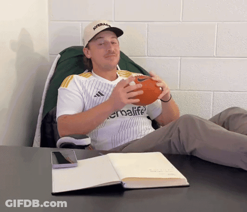 Man In Herbalife Jersey Holding Football GIF