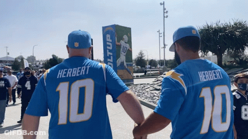 Man In Herbert Jersey Holding Hands With Another Man GIF
