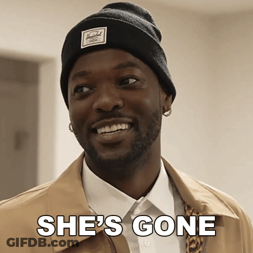 Man In Herschel Beanie Smiling Says She's Gone GIF