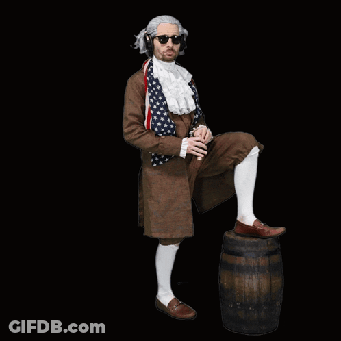 Man In Historical Costume Standing On Barrel Pointing GIF