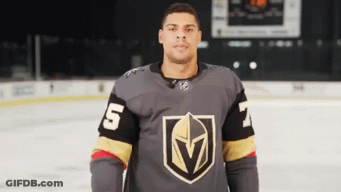 Man In Hockey Jersey Standing On Rink GIF