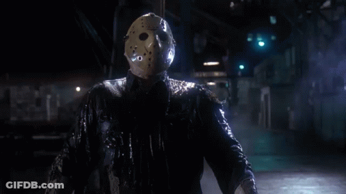 Man In Hockey Mask In Dark Room GIF